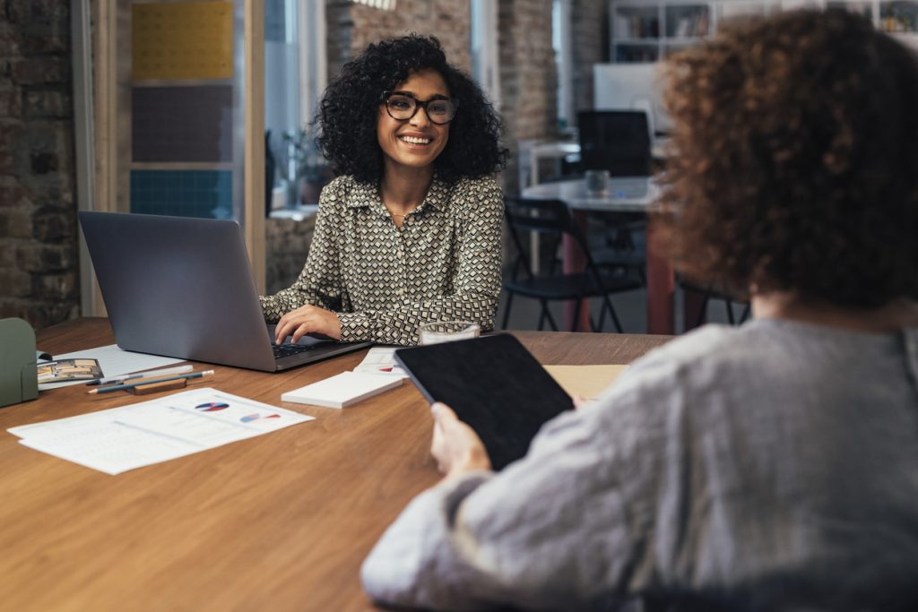 Two businesswomen working together at the office.